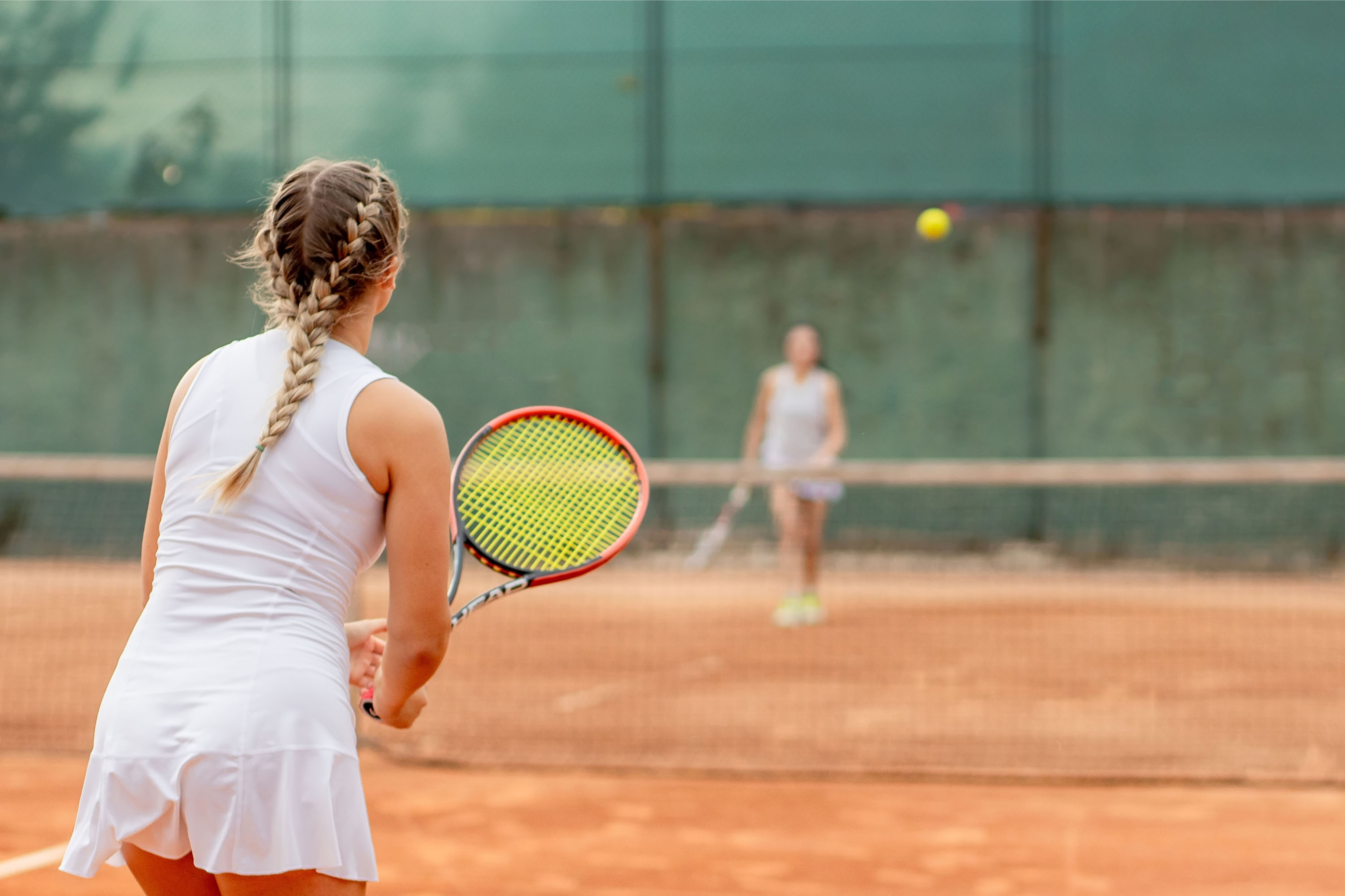 Tennis players on court during training